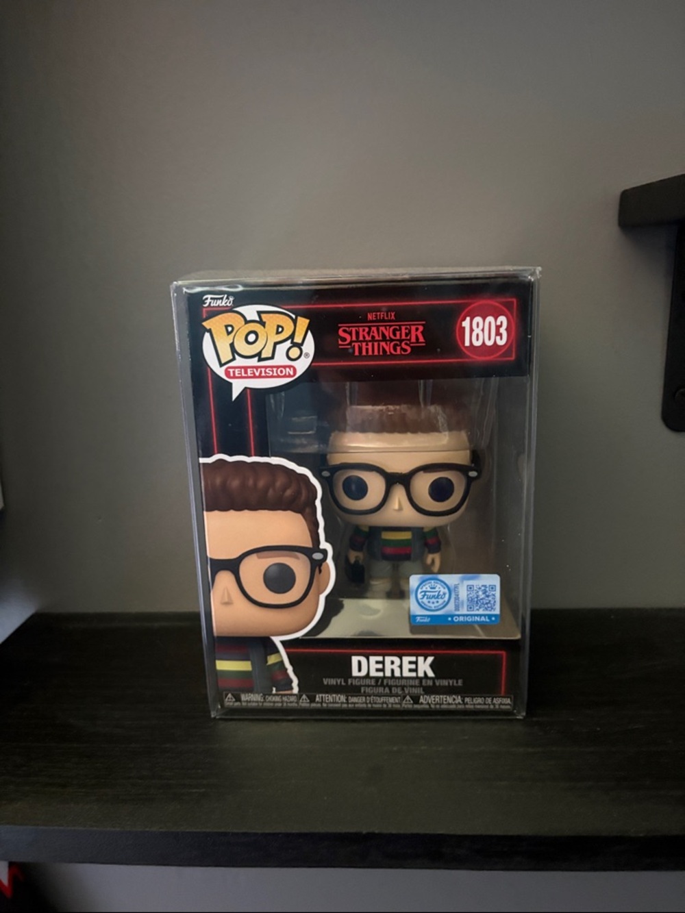 Funko Pop! Derek with Black Glasses and Multicolor Stripe Sweater